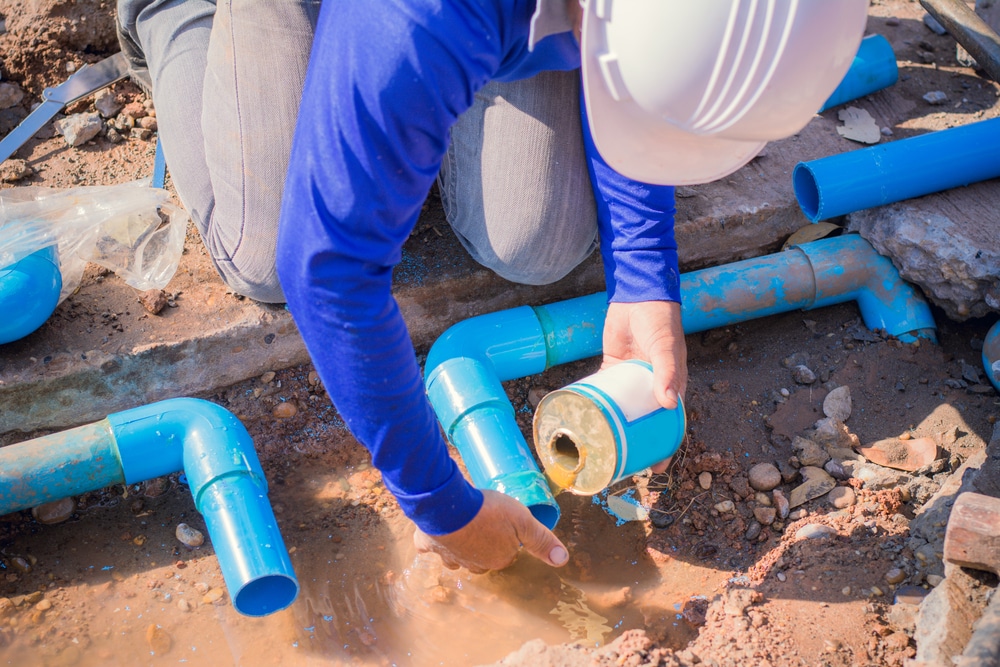 Expert repairing a pipe for the sewer